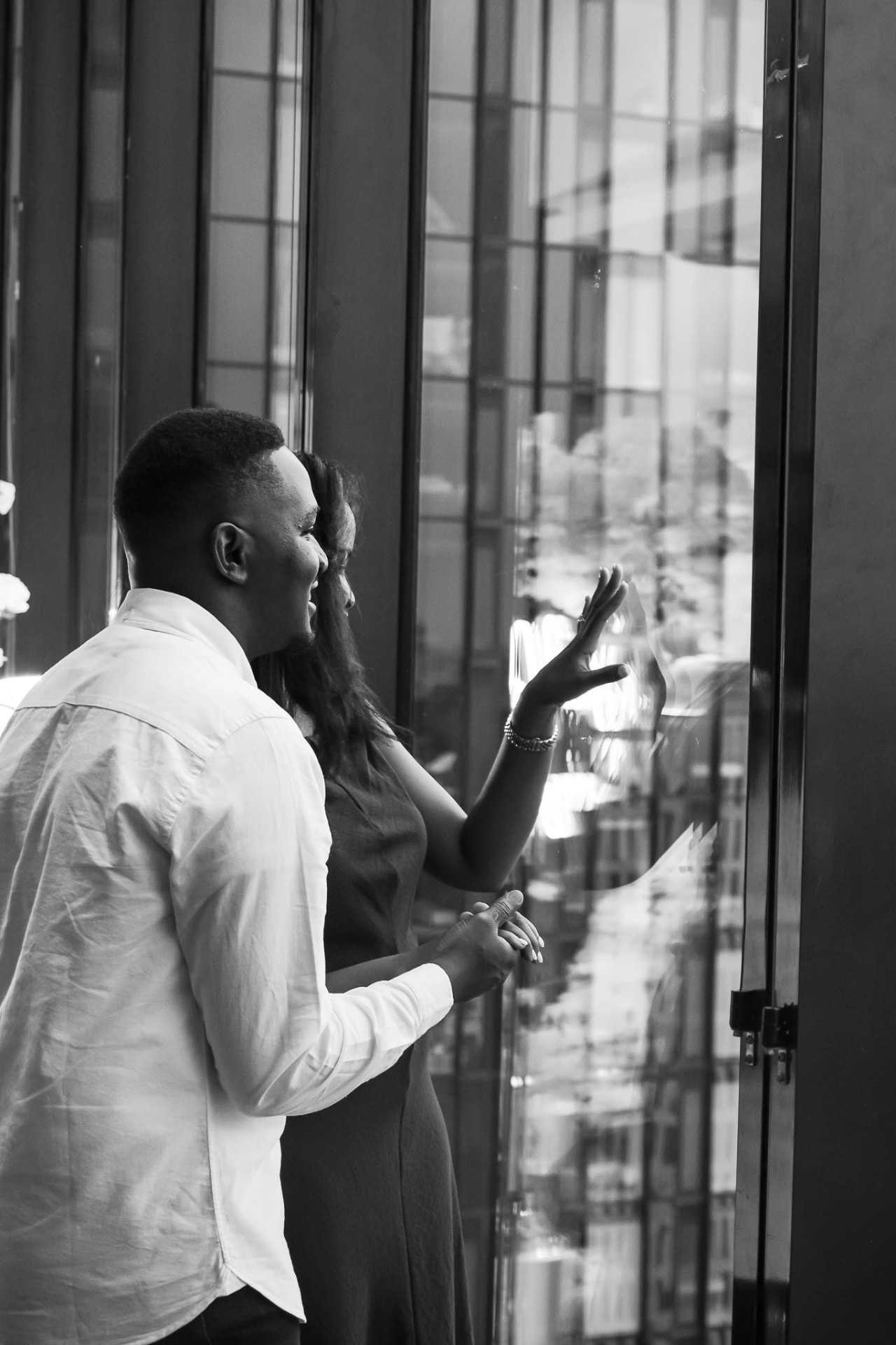 Emmanuel and Martha looking out over the city skyline